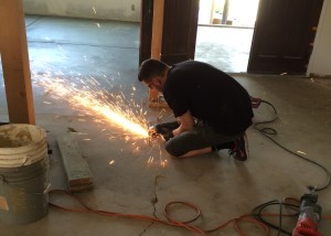 Sparks fly as Tim grinds off the extra support.