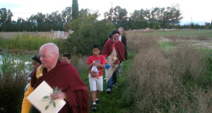 Processional to pond for fish release.