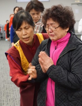 Wang Shui Fang during the Ceremony with the rinpoche who massaged her.