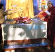 Bodhi Wentu Rinpoche and others inspect tub used in Ultimate Bathing the Buddha Ceremony held in Los Angeles