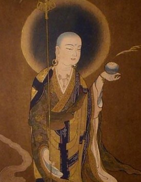 Ksitigarbha, the earth store bodhisattva, with his staff he uses to pound open the gates of Hell, and his cintamani pearl for illuminating all the various realms of hell, to benefit sentient beings trapped there.