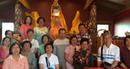 Visitors from Thailand visit temple.