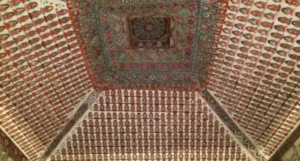 Cave #320 displays a pyramidal ceiling of a central peony design surrounded by a multitude of Buddhas on its four slopes