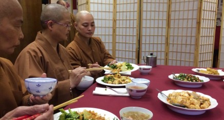 Nuns enjoying lunch served after Bathing the Buddha Dharma Assembly.