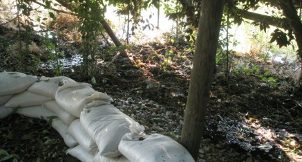 Sandbags were filled and placed to direct the water away from the temple.