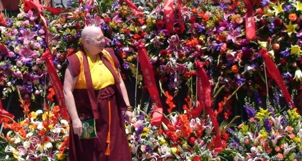 Zhaxi Zhuoma inspects the myriad of flowers sent to mark the coming to the temple of the much awaited treasure book.