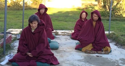 Pilgrims from Taiwan meditating in the Vajra Pole area.