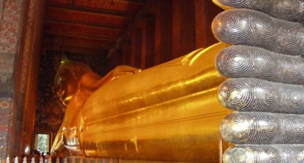 Giant Gold Statue of Reclining Buddha at Wat Po in Bangkok, Thailand.