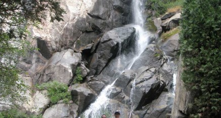 Two students in front of Grizzley Falls at Kings Canyon National Park after completing a retreat.