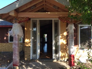 New entryway with partially unwrapped Flaming Jewel posts.