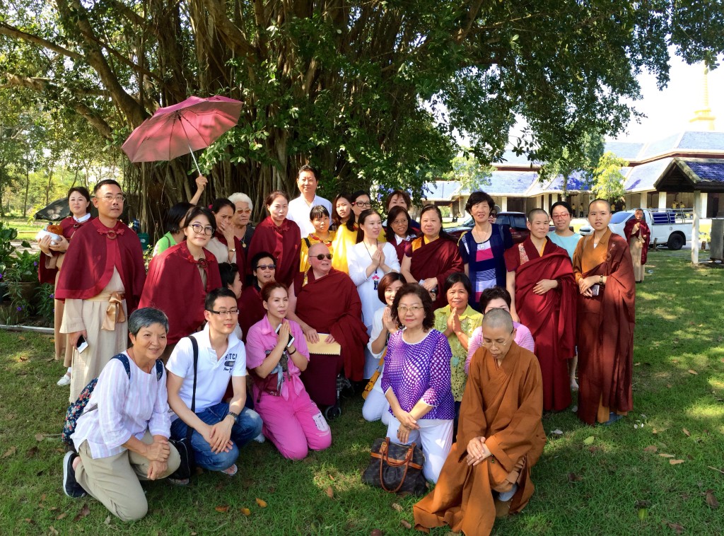 Sitting under the tree where H.H. Dorje Chang Buddha III gave a discourse to the Dragon fish and other animals and certain disciples in 1999. An account of that event can be found in the treasure book <em>H.H. Dorje Chang Buddha III.</em>