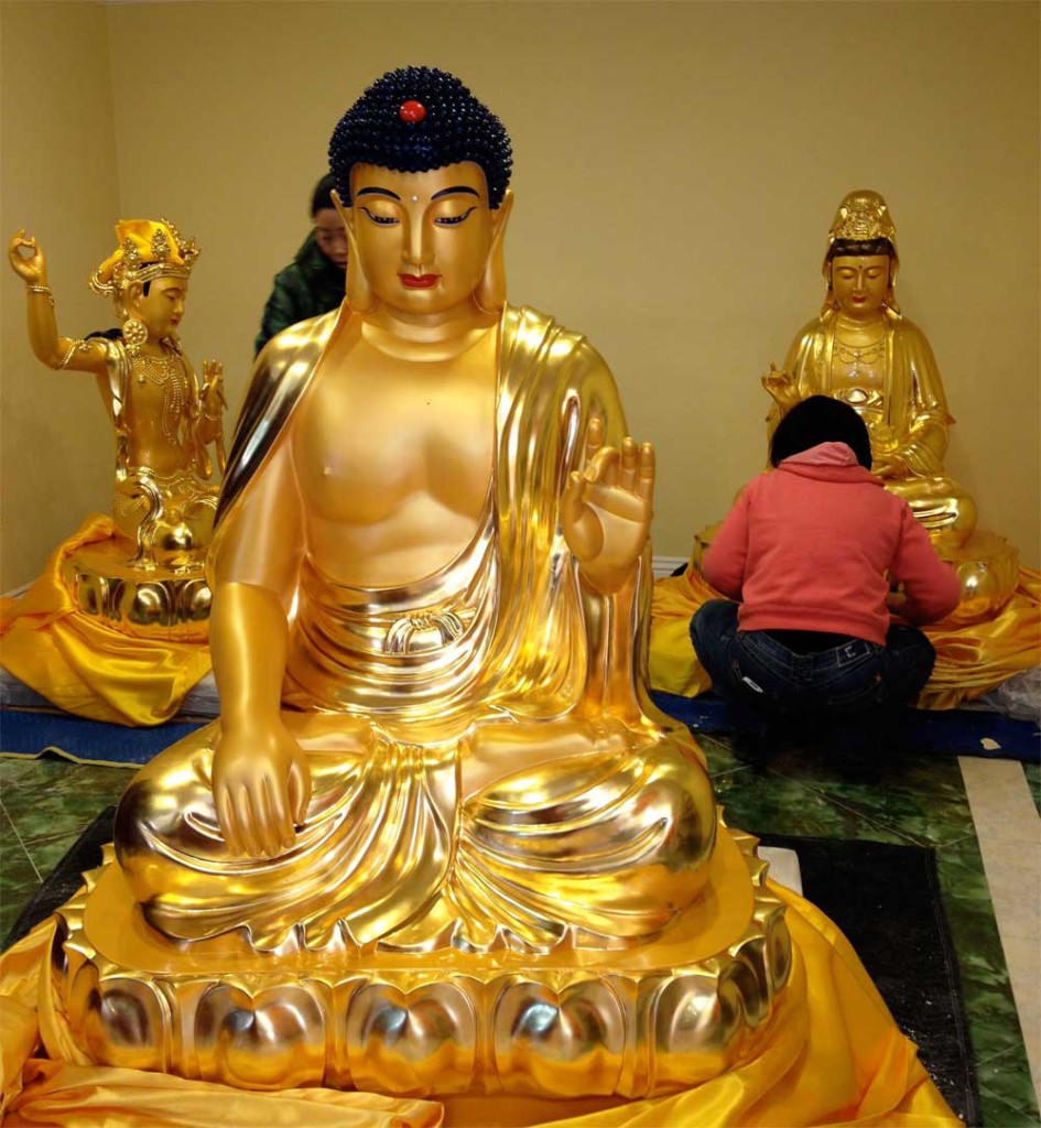 Shakyamuni Buddha in foreground with Manjushri Boddhsattva and Kuan Yin Bodhisattva in the background at the Dharma Center in Las Vegas before they were wrapped and sent to the Xuanfa Institute.