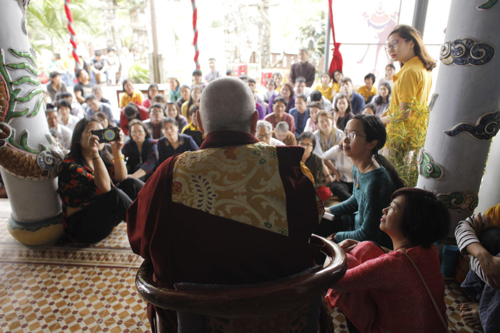 Listening to participants tell their experiences after the Kuan Yin Bodhisattva Great Compassion Empowerment in Da Nang, Vietnam.