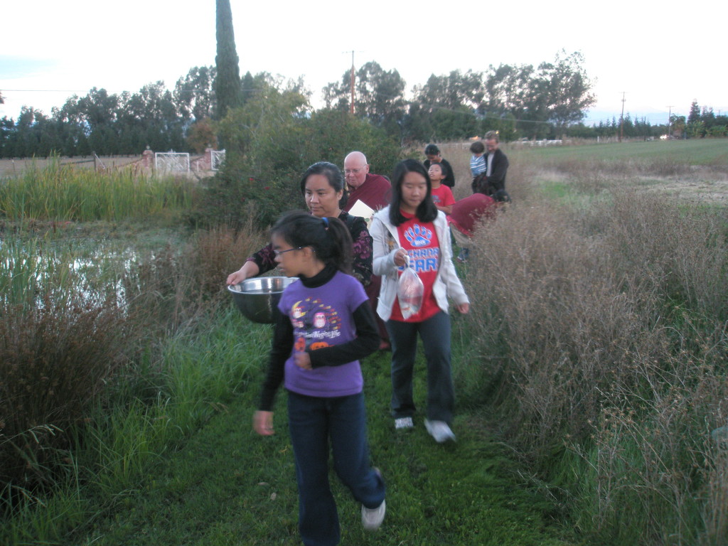 Processional to pond at Xuanfa Institute.